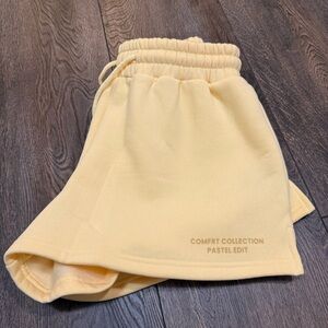 COMFRT butter yellow active wear shorts